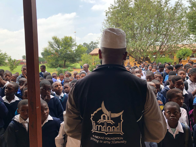 Representatives from Al-Imdaad Foundation’s Gauteng office address learners at Enkanyezini Primary School in Phiri, Soweto